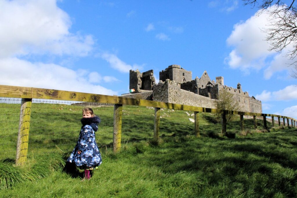 young girl outside rock of cashel